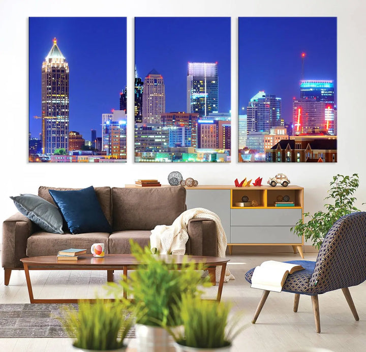 The modern living room is enhanced by the elegance of the "Atlanta City Lights Night Blue Skyline Cityscape Wall Art Canvas Print." This triptych, crafted on museum-quality canvas with a UV-protective coating, arrives ready to hang on the wall.