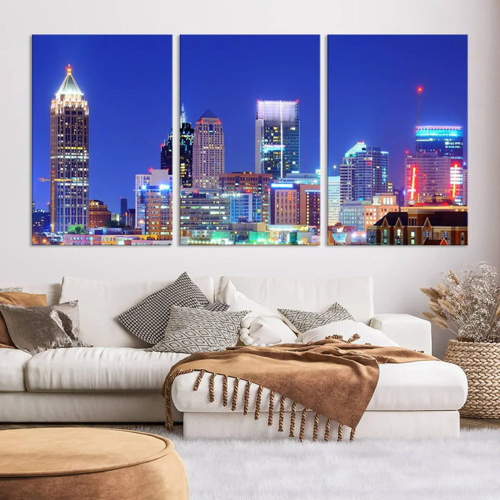 The modern living room is enhanced by the elegance of the "Atlanta City Lights Night Blue Skyline Cityscape Wall Art Canvas Print." This triptych, crafted on museum-quality canvas with a UV-protective coating, arrives ready to hang on the wall.