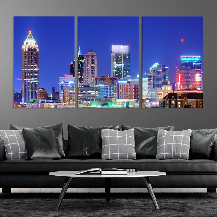 The modern living room is enhanced by the elegance of the "Atlanta City Lights Night Blue Skyline Cityscape Wall Art Canvas Print." This triptych, crafted on museum-quality canvas with a UV-protective coating, arrives ready to hang on the wall.