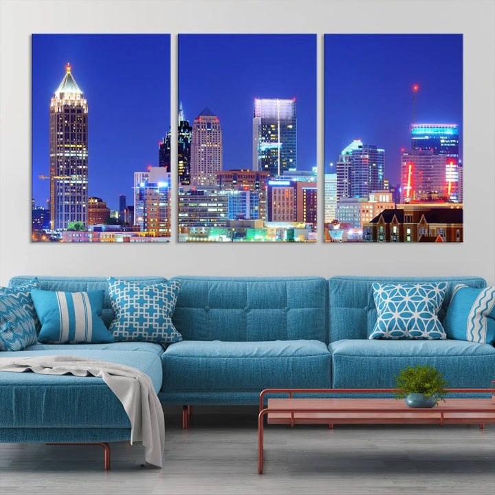 The modern living room is enhanced by the elegance of the "Atlanta City Lights Night Blue Skyline Cityscape Wall Art Canvas Print." This triptych, crafted on museum-quality canvas with a UV-protective coating, arrives ready to hang on the wall.