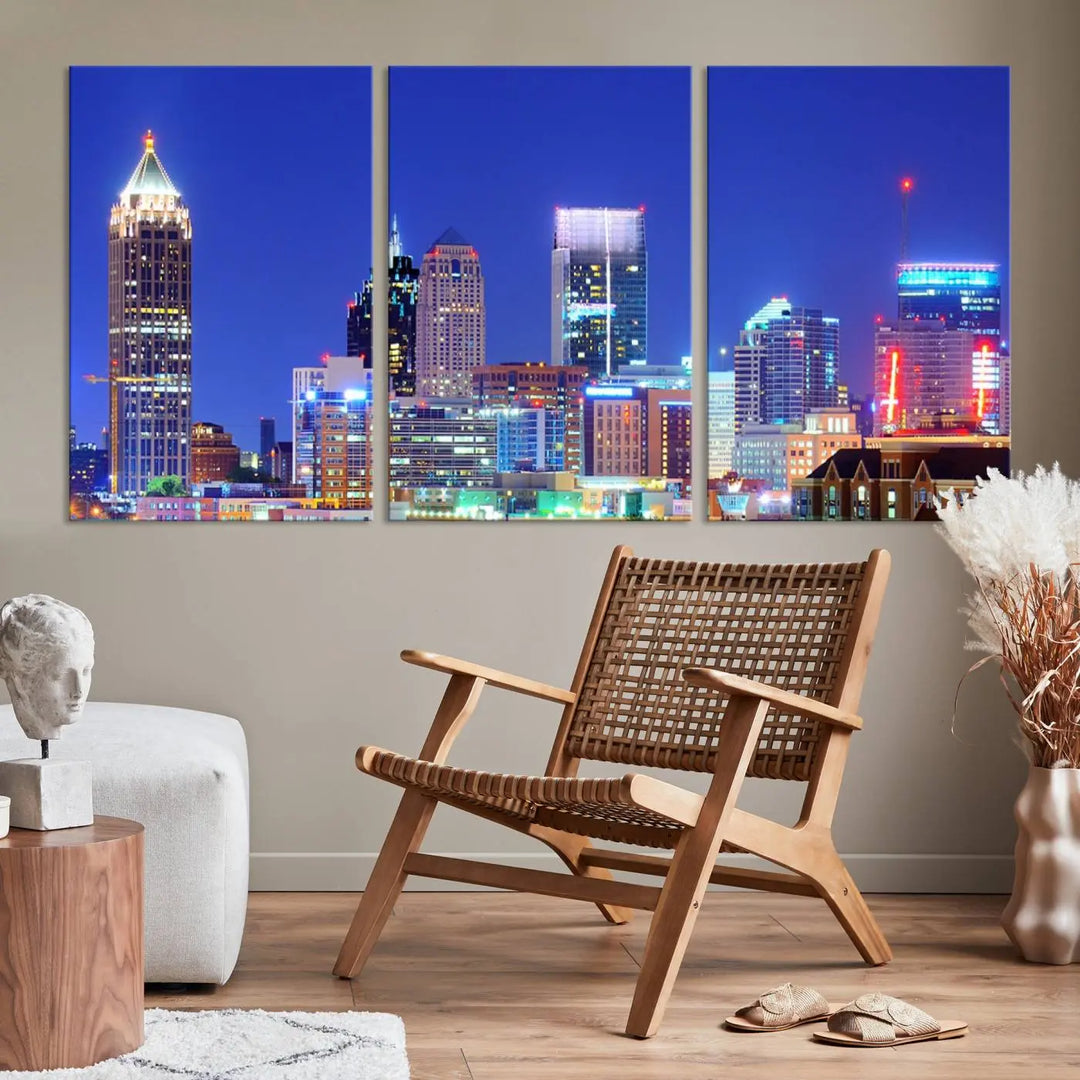 The modern living room is enhanced by the elegance of the "Atlanta City Lights Night Blue Skyline Cityscape Wall Art Canvas Print." This triptych, crafted on museum-quality canvas with a UV-protective coating, arrives ready to hang on the wall.