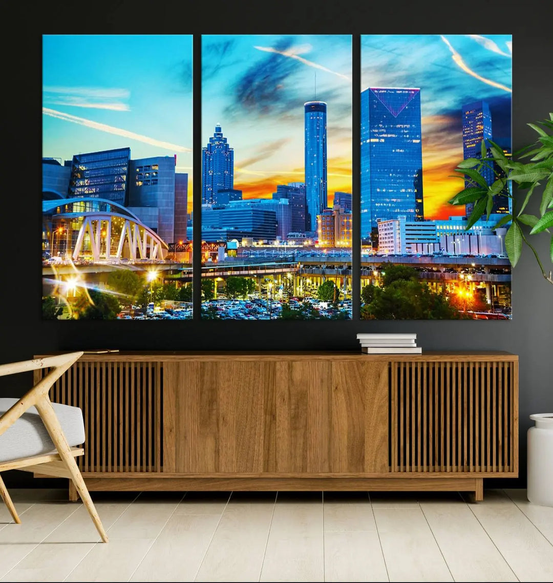 The Atlanta City Lights Sunset Blue and Orange Skyline Cityscape View Wall Art Canvas Print, crafted with vibrant colors on museum-quality canvas and a UV-protective coating, enhances the space in the living room.