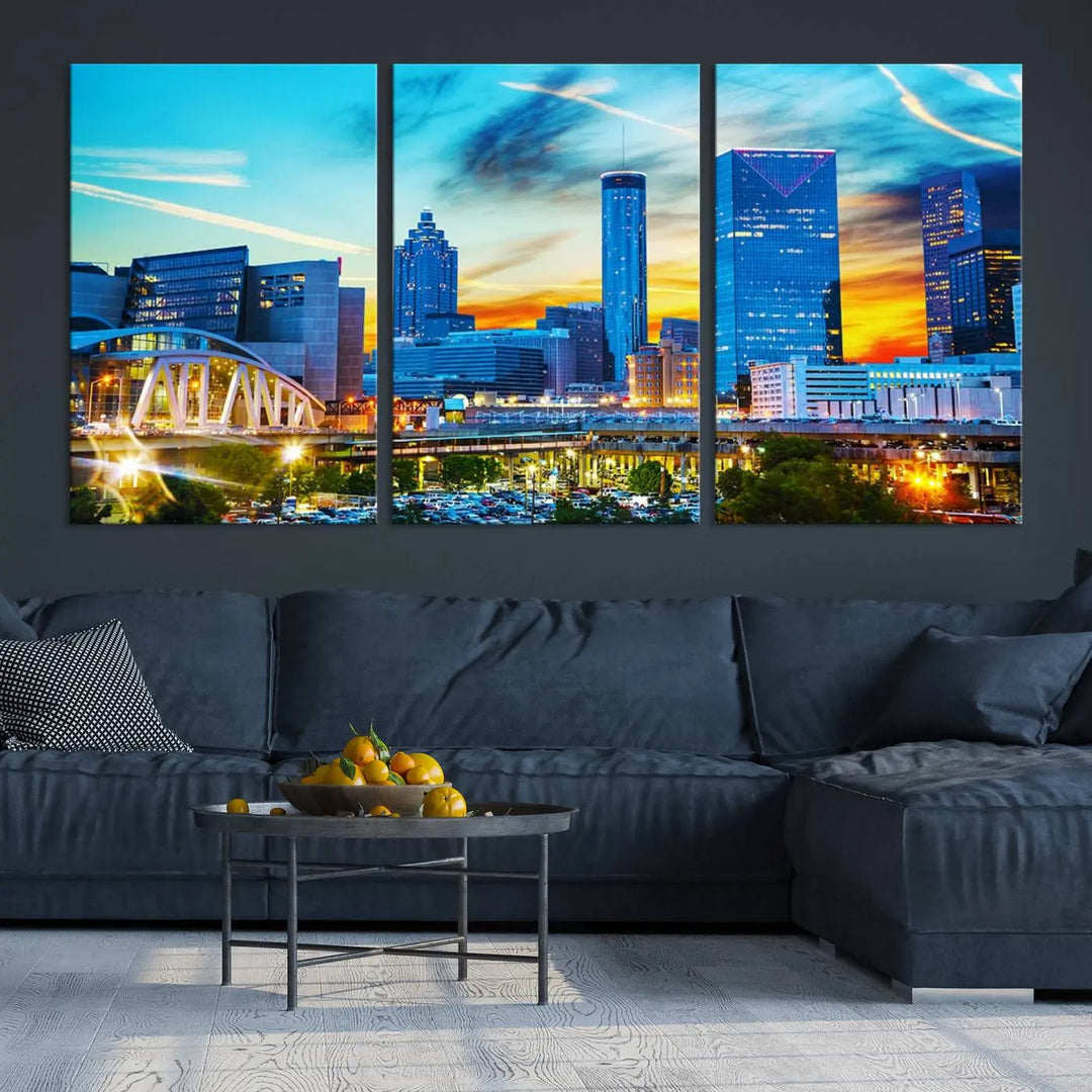 The Atlanta City Lights Sunset Blue and Orange Skyline Cityscape View Wall Art Canvas Print, crafted with vibrant colors on museum-quality canvas and a UV-protective coating, enhances the space in the living room.