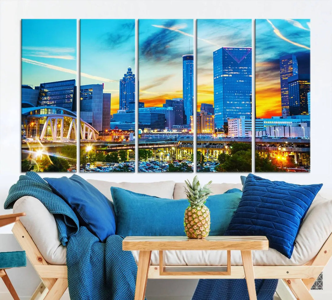 The Atlanta City Lights Sunset Blue and Orange Skyline Cityscape View Wall Art Canvas Print, crafted with vibrant colors on museum-quality canvas and a UV-protective coating, enhances the space in the living room.