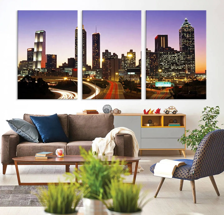 The Atlanta City Lights Sunset Purple Skyline Cityscape View wall art canvas print on the wall adds a touch of sophistication and transforms the space into an elegant sanctuary. The gallery-wrapped canvas print enhances the room's ambiance with its striking beauty.