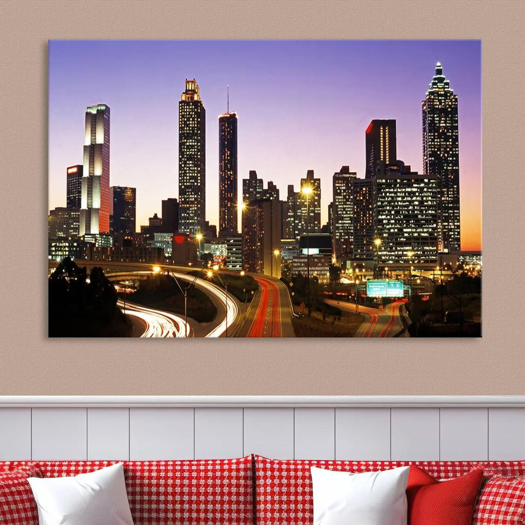 The Atlanta City Lights Sunset Purple Skyline Cityscape View wall art canvas print on the wall adds a touch of sophistication and transforms the space into an elegant sanctuary. The gallery-wrapped canvas print enhances the room's ambiance with its striking beauty.