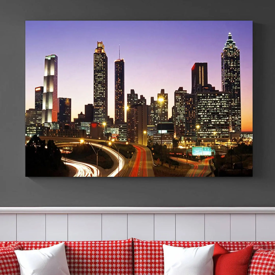 The Atlanta City Lights Sunset Purple Skyline Cityscape View wall art canvas print on the wall adds a touch of sophistication and transforms the space into an elegant sanctuary. The gallery-wrapped canvas print enhances the room's ambiance with its striking beauty.