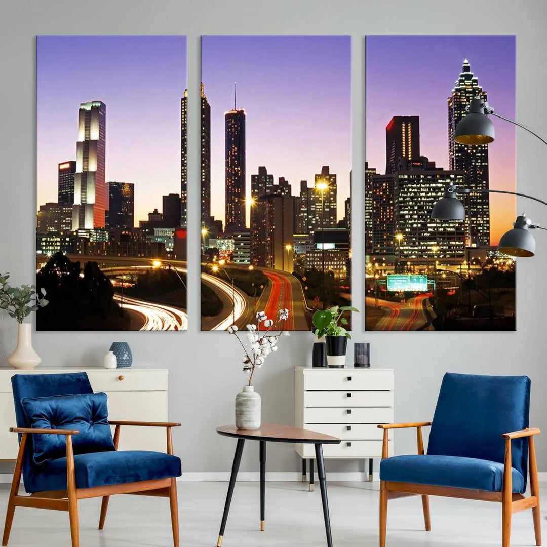 The Atlanta City Lights Sunset Purple Skyline Cityscape View wall art canvas print on the wall adds a touch of sophistication and transforms the space into an elegant sanctuary. The gallery-wrapped canvas print enhances the room's ambiance with its striking beauty.