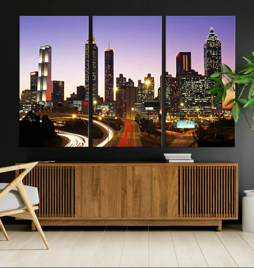 The Atlanta City Lights Sunset Purple Skyline Cityscape View wall art canvas print on the wall adds a touch of sophistication and transforms the space into an elegant sanctuary. The gallery-wrapped canvas print enhances the room's ambiance with its striking beauty.