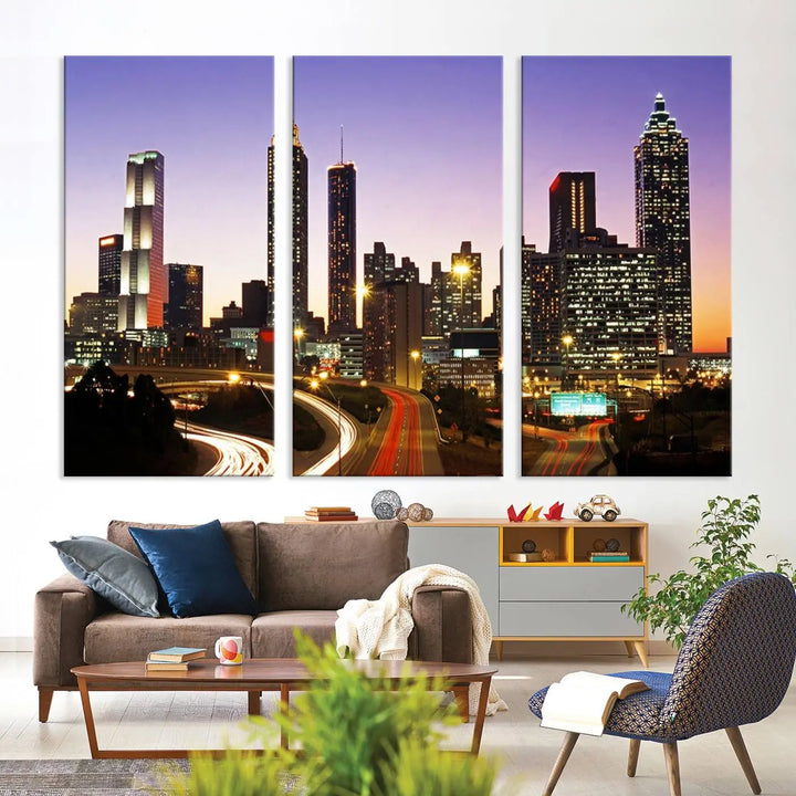 The Atlanta City Lights Sunset Purple Skyline Cityscape View wall art canvas print on the wall adds a touch of sophistication and transforms the space into an elegant sanctuary. The gallery-wrapped canvas print enhances the room's ambiance with its striking beauty.