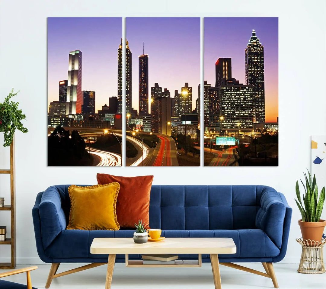 The Atlanta City Lights Sunset Purple Skyline Cityscape View wall art canvas print on the wall adds a touch of sophistication and transforms the space into an elegant sanctuary. The gallery-wrapped canvas print enhances the room's ambiance with its striking beauty.