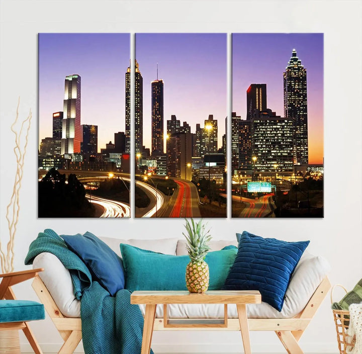 The Atlanta City Lights Sunset Purple Skyline Cityscape View wall art canvas print on the wall adds a touch of sophistication and transforms the space into an elegant sanctuary. The gallery-wrapped canvas print enhances the room's ambiance with its striking beauty.