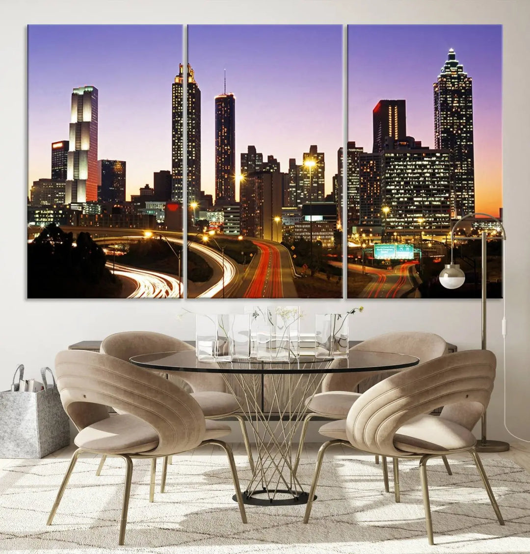 The Atlanta City Lights Sunset Purple Skyline Cityscape View wall art canvas print on the wall adds a touch of sophistication and transforms the space into an elegant sanctuary. The gallery-wrapped canvas print enhances the room's ambiance with its striking beauty.