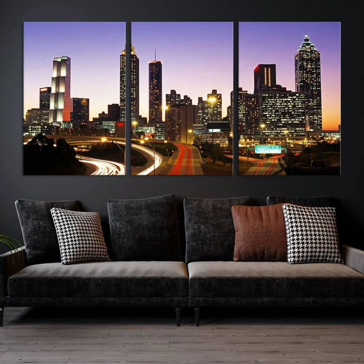 The Atlanta City Lights Sunset Purple Skyline Cityscape View wall art canvas print on the wall adds a touch of sophistication and transforms the space into an elegant sanctuary. The gallery-wrapped canvas print enhances the room's ambiance with its striking beauty.