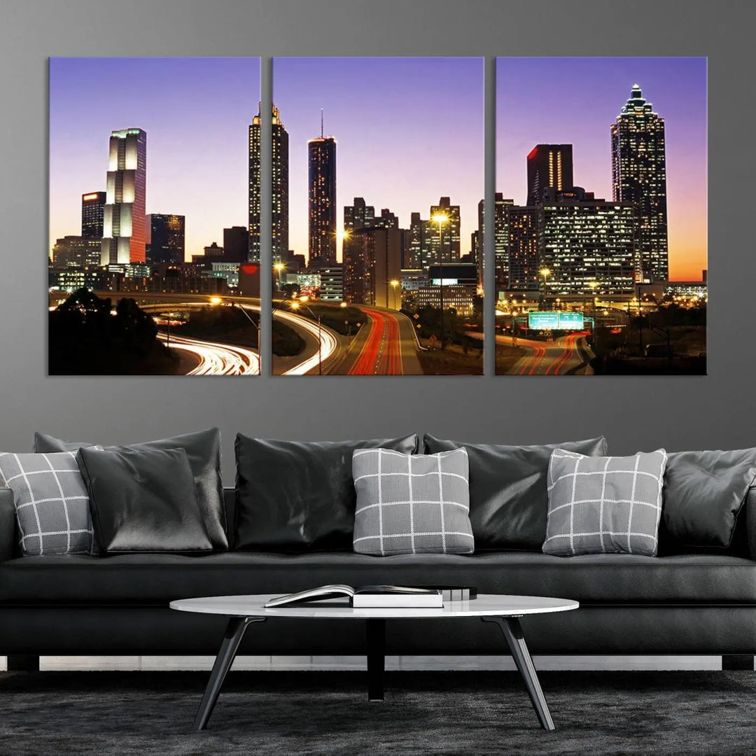 The Atlanta City Lights Sunset Purple Skyline Cityscape View wall art canvas print on the wall adds a touch of sophistication and transforms the space into an elegant sanctuary. The gallery-wrapped canvas print enhances the room's ambiance with its striking beauty.