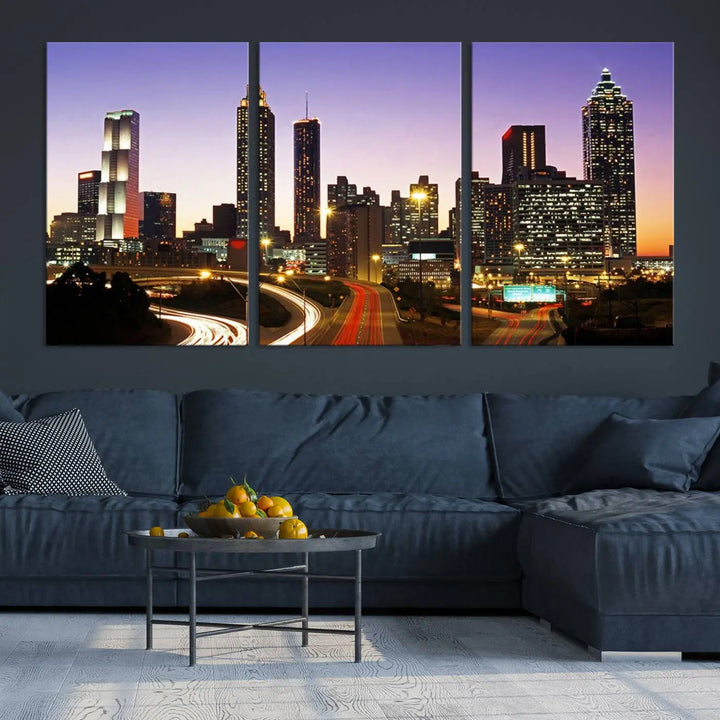 The Atlanta City Lights Sunset Purple Skyline Cityscape View wall art canvas print on the wall adds a touch of sophistication and transforms the space into an elegant sanctuary. The gallery-wrapped canvas print enhances the room's ambiance with its striking beauty.