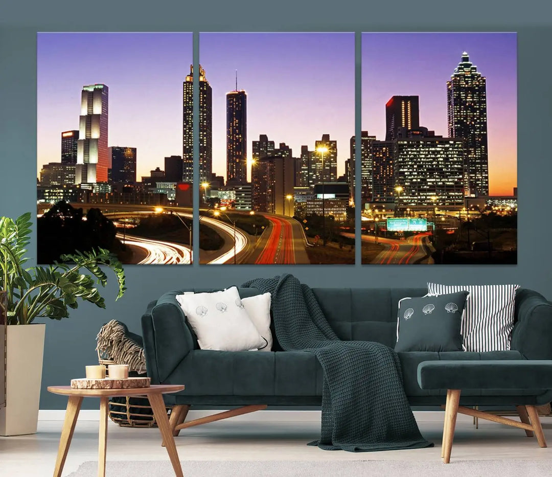 The Atlanta City Lights Sunset Purple Skyline Cityscape View wall art canvas print on the wall adds a touch of sophistication and transforms the space into an elegant sanctuary. The gallery-wrapped canvas print enhances the room's ambiance with its striking beauty.