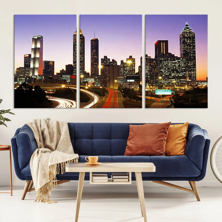 The Atlanta City Lights Sunset Purple Skyline Cityscape View wall art canvas print on the wall adds a touch of sophistication and transforms the space into an elegant sanctuary. The gallery-wrapped canvas print enhances the room's ambiance with its striking beauty.