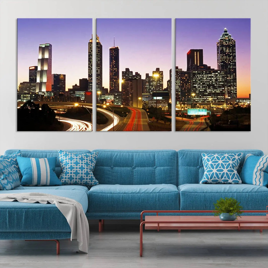 The Atlanta City Lights Sunset Purple Skyline Cityscape View wall art canvas print on the wall adds a touch of sophistication and transforms the space into an elegant sanctuary. The gallery-wrapped canvas print enhances the room's ambiance with its striking beauty.