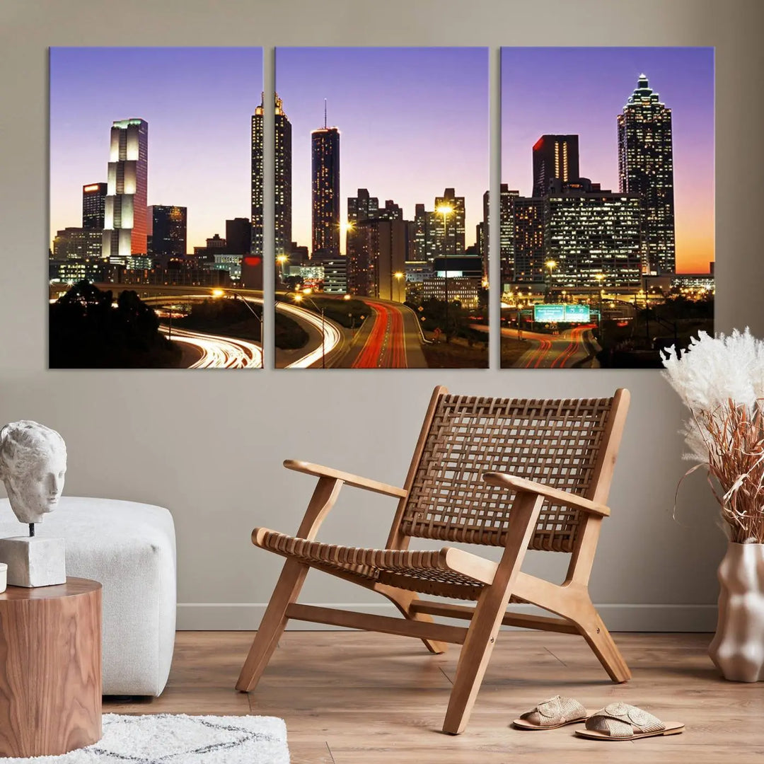 The Atlanta City Lights Sunset Purple Skyline Cityscape View wall art canvas print on the wall adds a touch of sophistication and transforms the space into an elegant sanctuary. The gallery-wrapped canvas print enhances the room's ambiance with its striking beauty.