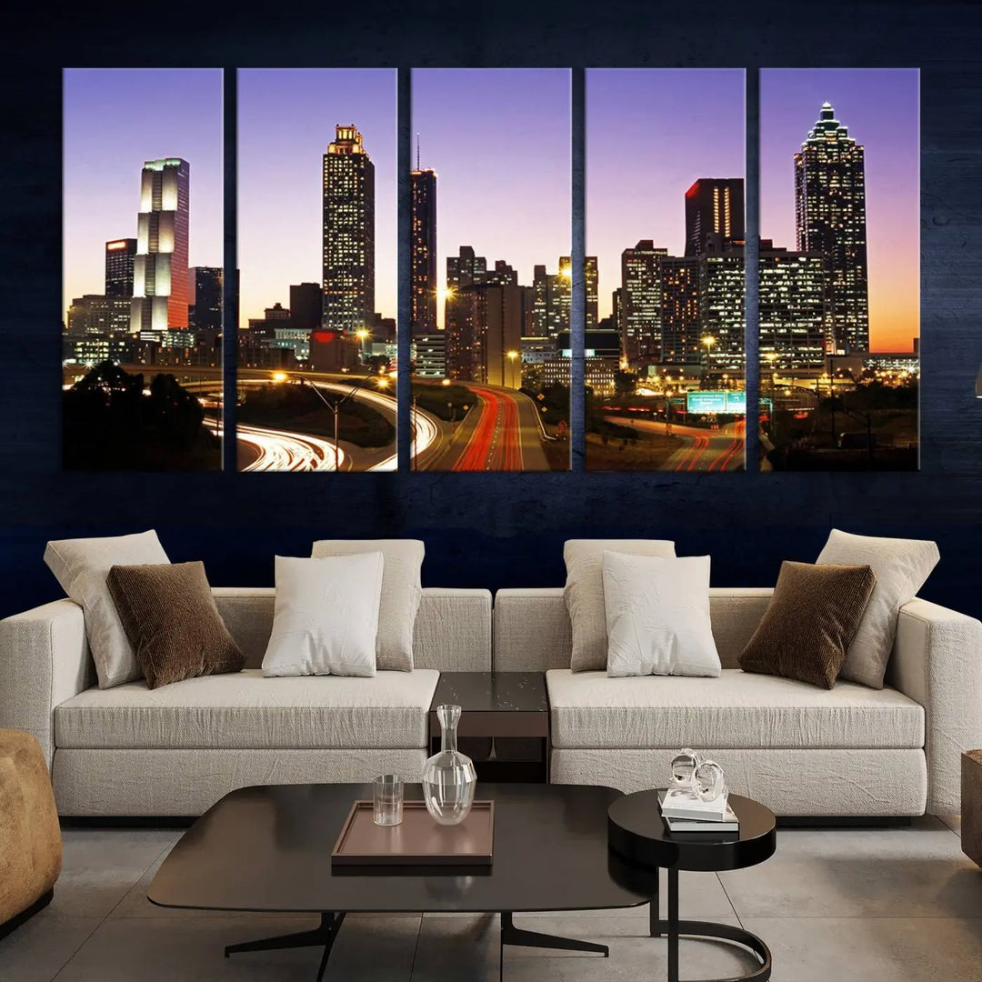 The Atlanta City Lights Sunset Purple Skyline Cityscape View wall art canvas print on the wall adds a touch of sophistication and transforms the space into an elegant sanctuary. The gallery-wrapped canvas print enhances the room's ambiance with its striking beauty.