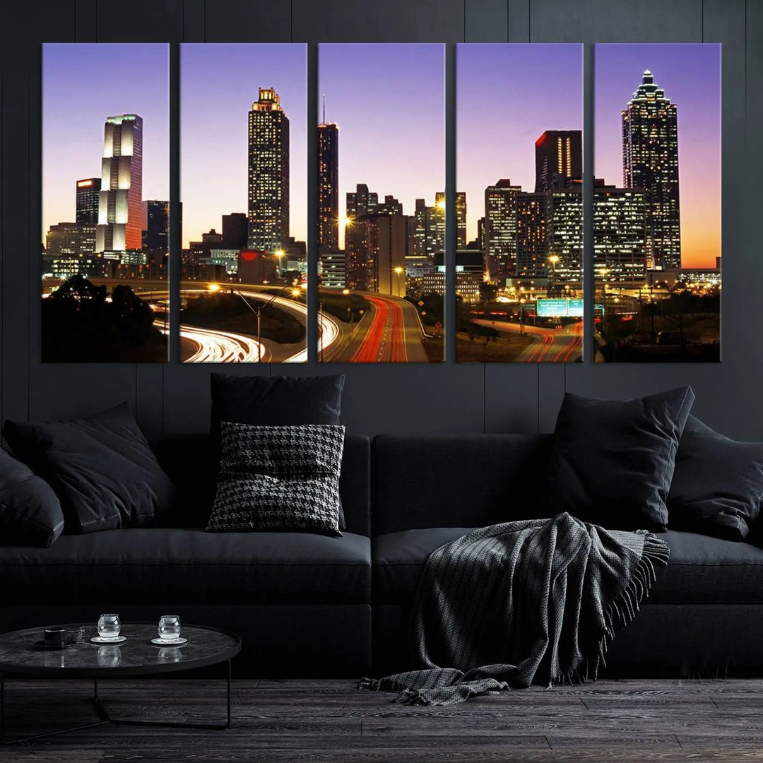 The Atlanta City Lights Sunset Purple Skyline Cityscape View wall art canvas print on the wall adds a touch of sophistication and transforms the space into an elegant sanctuary. The gallery-wrapped canvas print enhances the room's ambiance with its striking beauty.