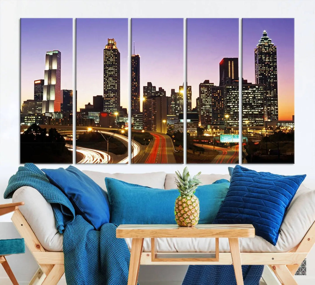 The Atlanta City Lights Sunset Purple Skyline Cityscape View wall art canvas print on the wall adds a touch of sophistication and transforms the space into an elegant sanctuary. The gallery-wrapped canvas print enhances the room's ambiance with its striking beauty.