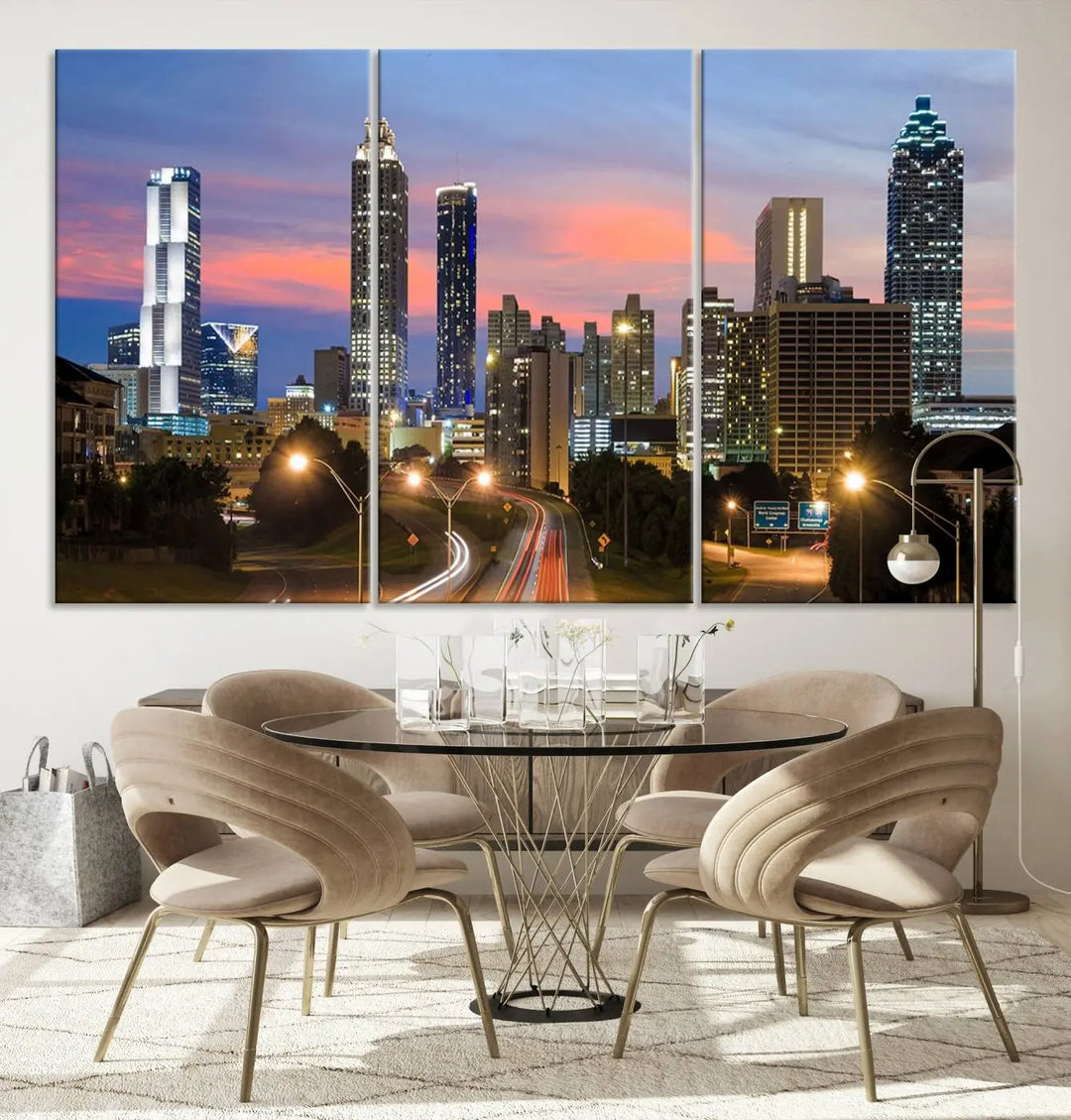 The Atlanta City Lights Sunset Skyline Cityscape View Wall Art Canvas Print is showcased in a modern living room. This artwork is gallery-wrapped on museum-quality canvas and features a UV-protective coating to maintain its vibrant colors.