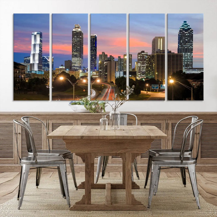 The Atlanta City Lights Sunset Skyline Cityscape View Wall Art Canvas Print is showcased in a modern living room. This artwork is gallery-wrapped on museum-quality canvas and features a UV-protective coating to maintain its vibrant colors.