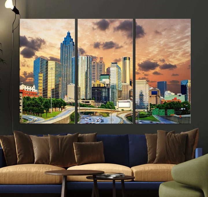 The wall is adorned with the Atlanta City Lights Sunset Skyline Cityscape View Wall Art Canvas Print, elegantly gallery wrapped and showcasing a skyline beneath a partly cloudy sky. This piece is created on museum-quality canvas and features a UV-protective coating to ensure lasting vibrancy.