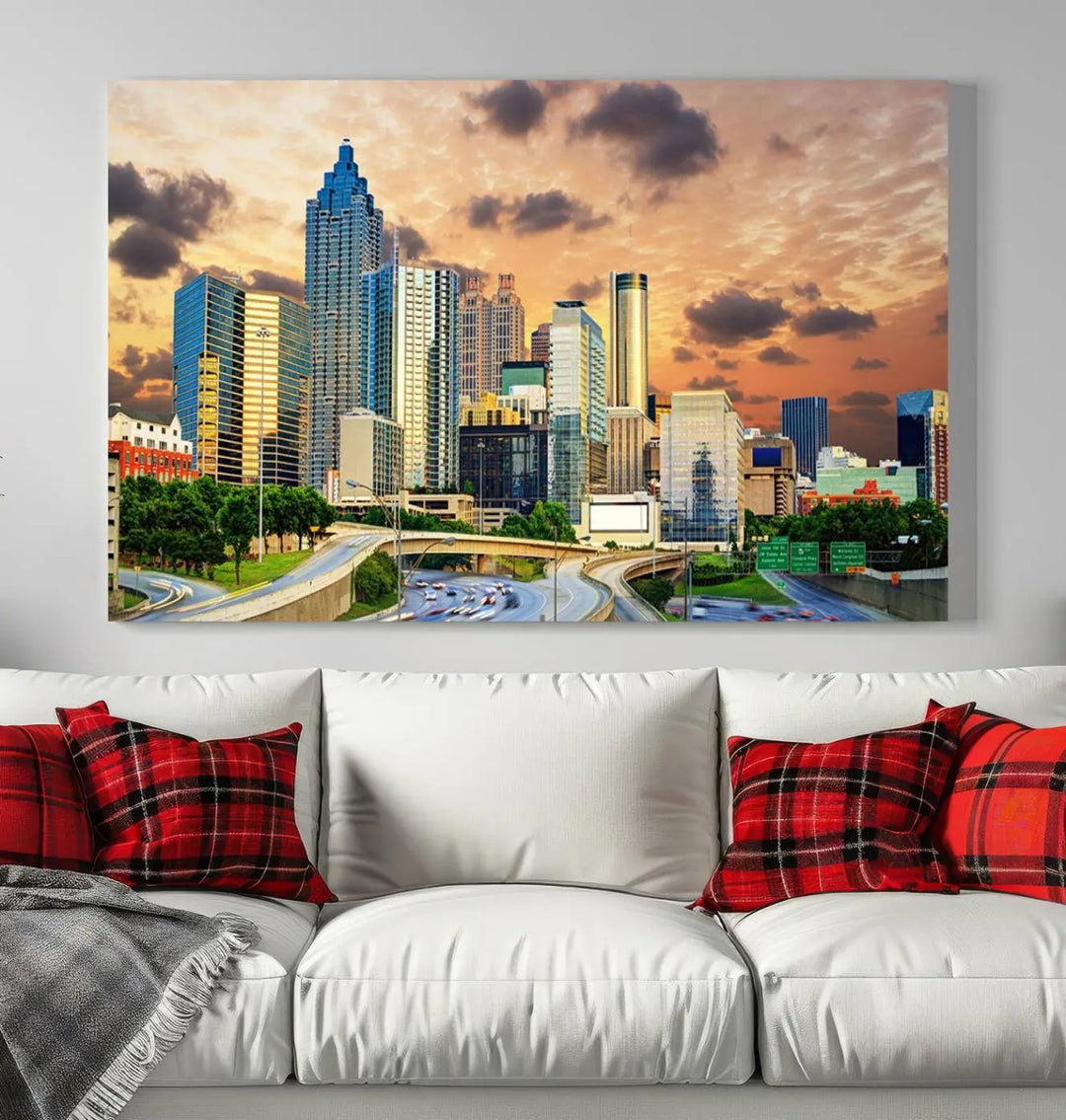 The wall is adorned with the Atlanta City Lights Sunset Skyline Cityscape View Wall Art Canvas Print, elegantly gallery wrapped and showcasing a skyline beneath a partly cloudy sky. This piece is created on museum-quality canvas and features a UV-protective coating to ensure lasting vibrancy.