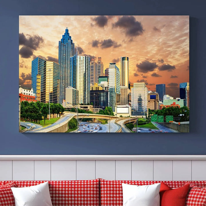 The wall is adorned with the Atlanta City Lights Sunset Skyline Cityscape View Wall Art Canvas Print, elegantly gallery wrapped and showcasing a skyline beneath a partly cloudy sky. This piece is created on museum-quality canvas and features a UV-protective coating to ensure lasting vibrancy.