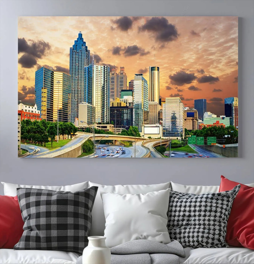 The wall is adorned with the Atlanta City Lights Sunset Skyline Cityscape View Wall Art Canvas Print, elegantly gallery wrapped and showcasing a skyline beneath a partly cloudy sky. This piece is created on museum-quality canvas and features a UV-protective coating to ensure lasting vibrancy.