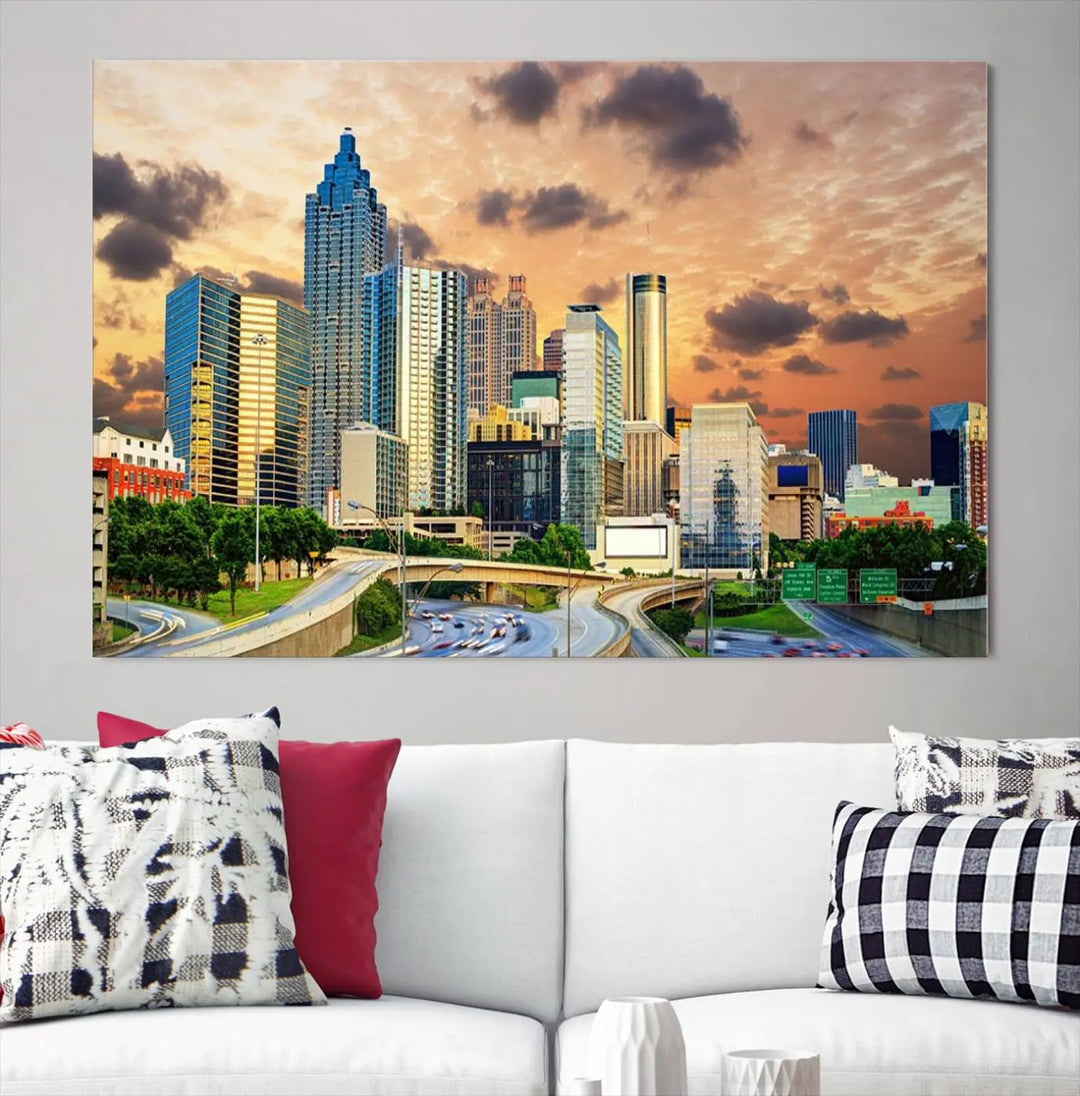 The wall is adorned with the Atlanta City Lights Sunset Skyline Cityscape View Wall Art Canvas Print, elegantly gallery wrapped and showcasing a skyline beneath a partly cloudy sky. This piece is created on museum-quality canvas and features a UV-protective coating to ensure lasting vibrancy.