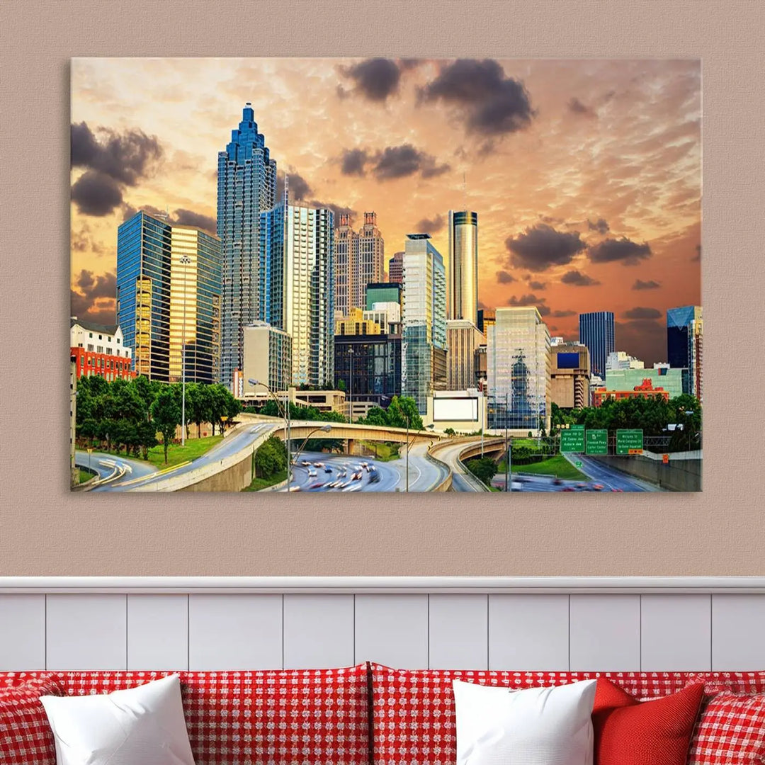 The wall is adorned with the Atlanta City Lights Sunset Skyline Cityscape View Wall Art Canvas Print, elegantly gallery wrapped and showcasing a skyline beneath a partly cloudy sky. This piece is created on museum-quality canvas and features a UV-protective coating to ensure lasting vibrancy.