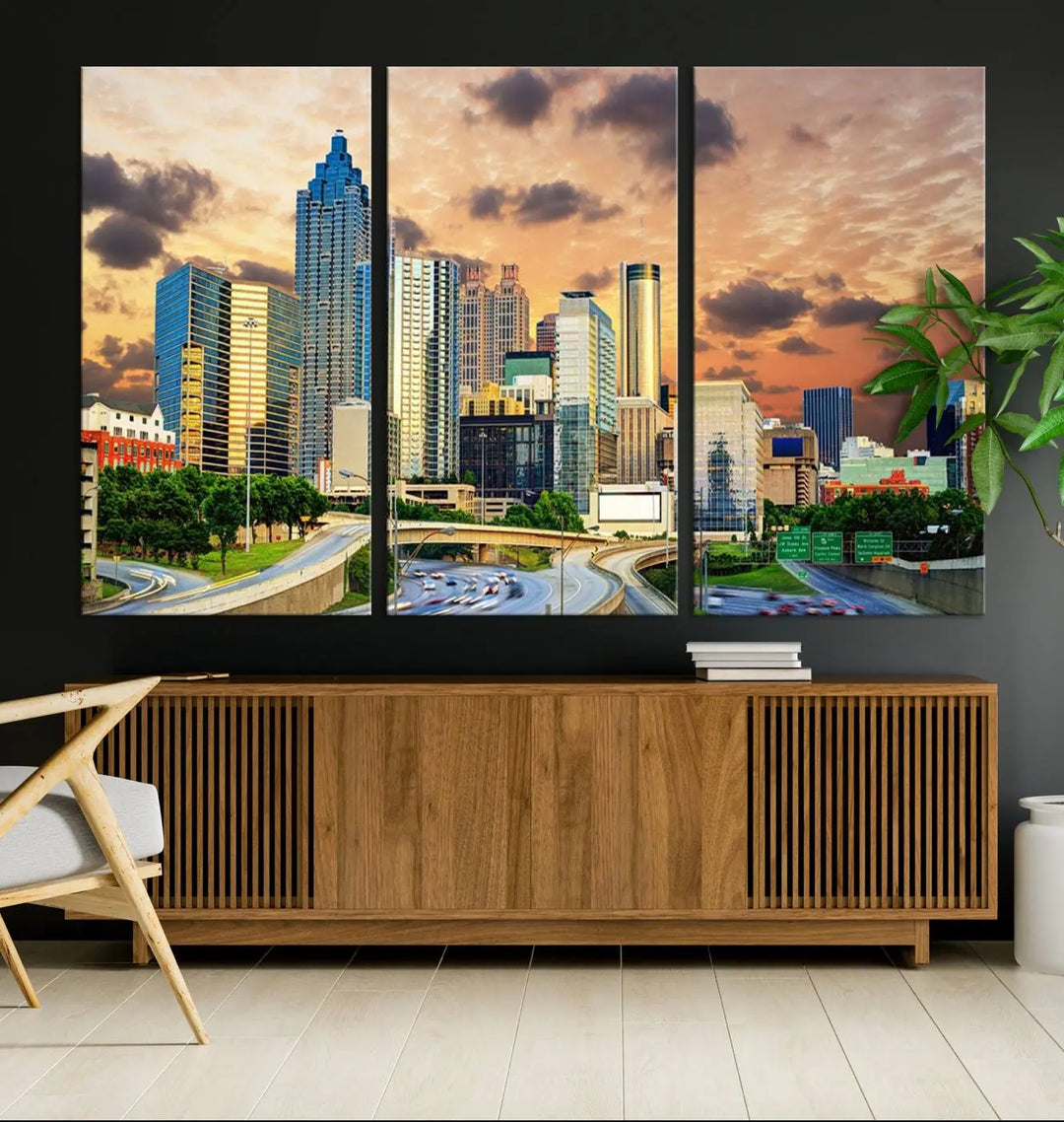 The wall is adorned with the Atlanta City Lights Sunset Skyline Cityscape View Wall Art Canvas Print, elegantly gallery wrapped and showcasing a skyline beneath a partly cloudy sky. This piece is created on museum-quality canvas and features a UV-protective coating to ensure lasting vibrancy.