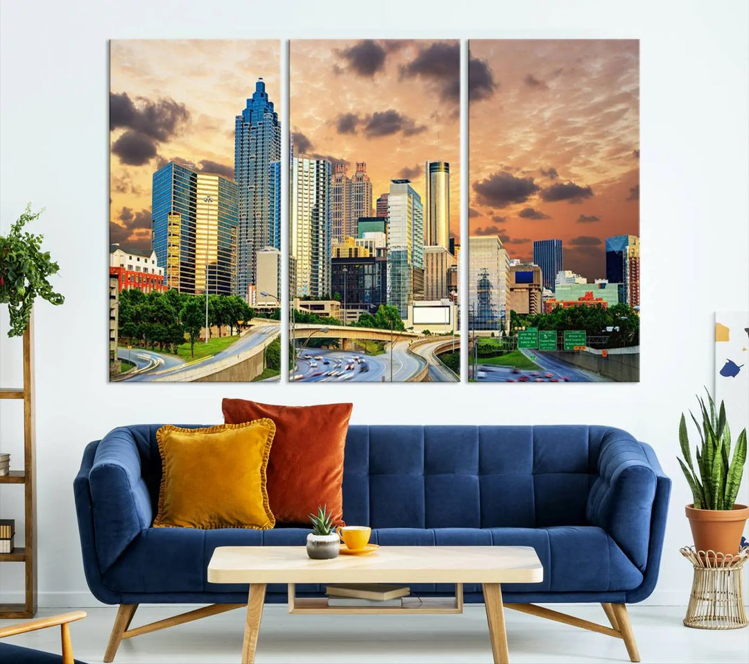 The wall is adorned with the Atlanta City Lights Sunset Skyline Cityscape View Wall Art Canvas Print, elegantly gallery wrapped and showcasing a skyline beneath a partly cloudy sky. This piece is created on museum-quality canvas and features a UV-protective coating to ensure lasting vibrancy.