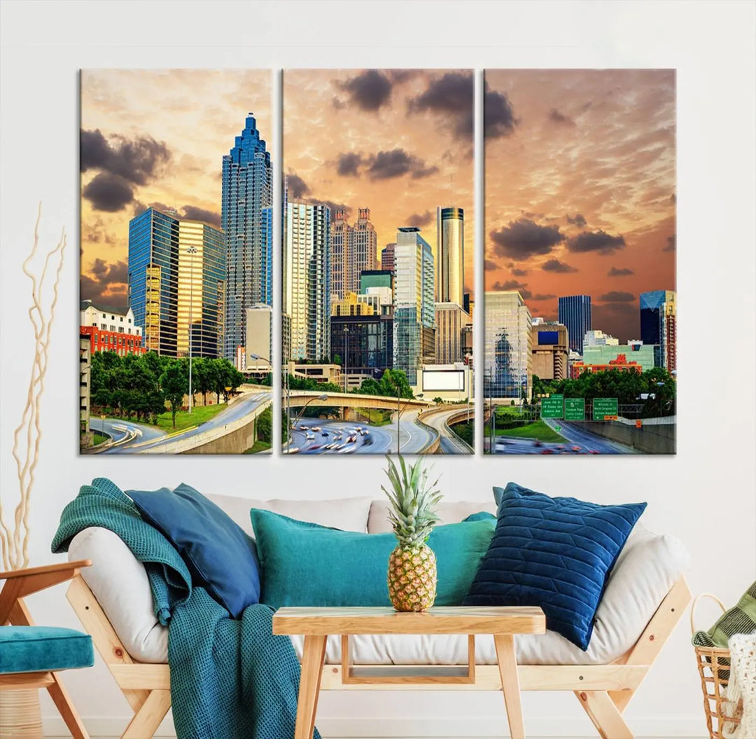 The wall is adorned with the Atlanta City Lights Sunset Skyline Cityscape View Wall Art Canvas Print, elegantly gallery wrapped and showcasing a skyline beneath a partly cloudy sky. This piece is created on museum-quality canvas and features a UV-protective coating to ensure lasting vibrancy.