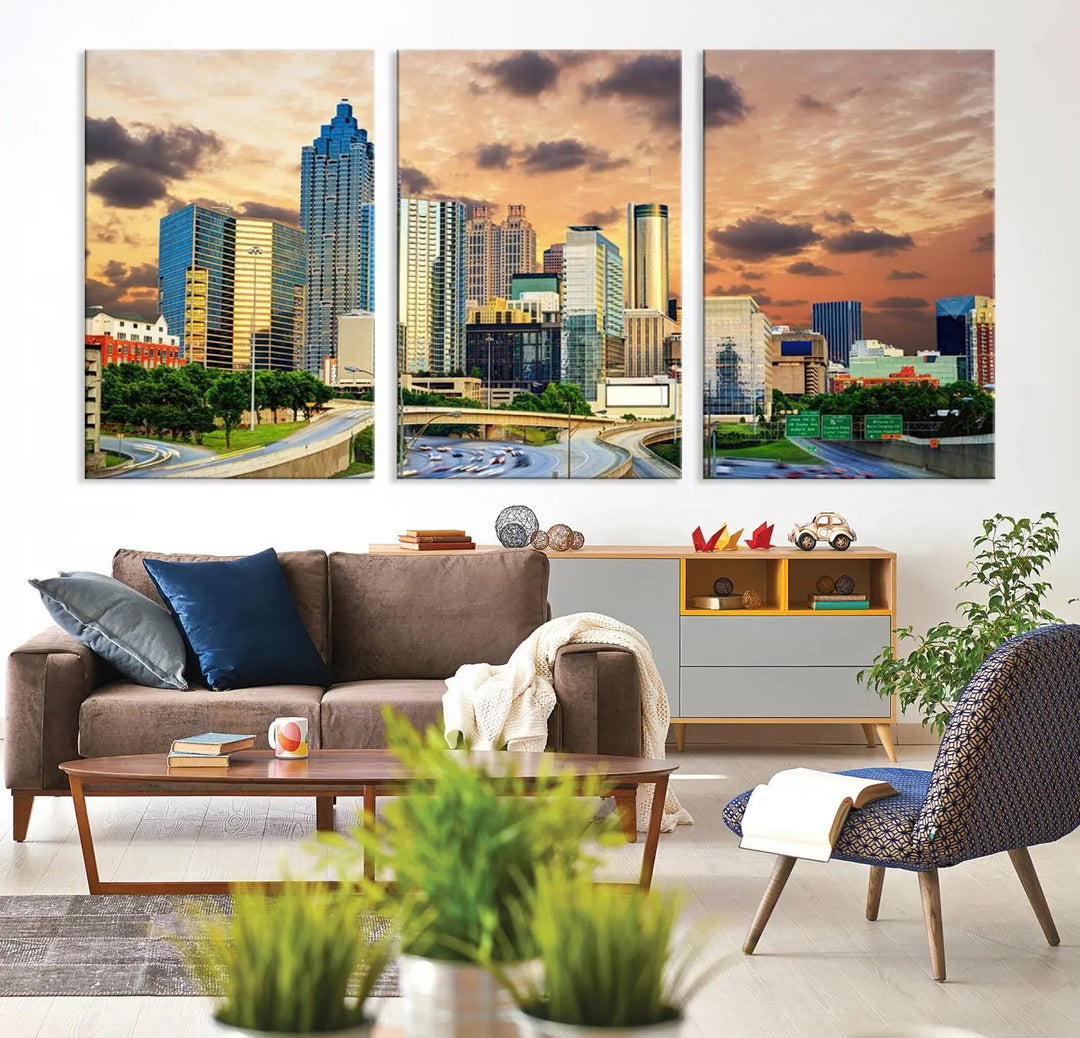 The wall is adorned with the Atlanta City Lights Sunset Skyline Cityscape View Wall Art Canvas Print, elegantly gallery wrapped and showcasing a skyline beneath a partly cloudy sky. This piece is created on museum-quality canvas and features a UV-protective coating to ensure lasting vibrancy.