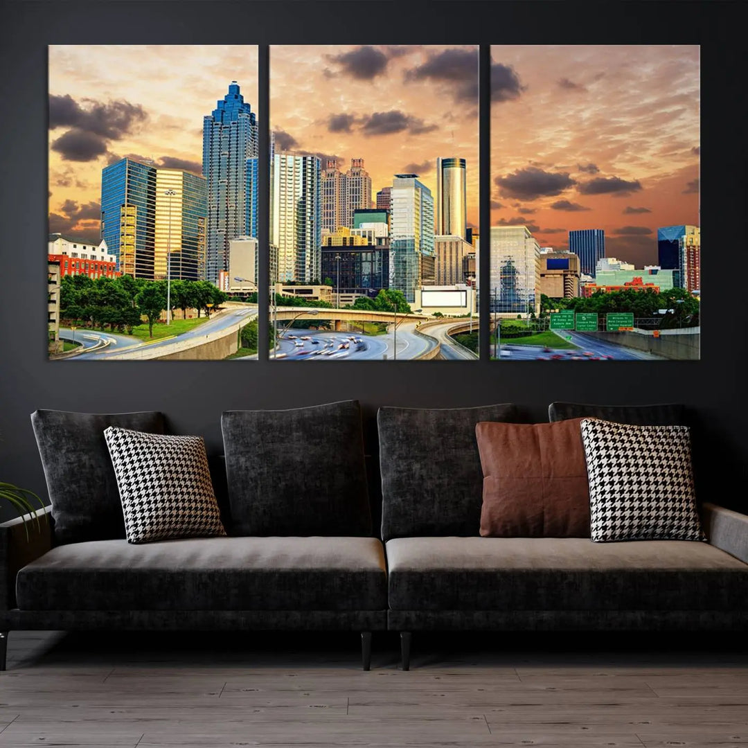 The wall is adorned with the Atlanta City Lights Sunset Skyline Cityscape View Wall Art Canvas Print, elegantly gallery wrapped and showcasing a skyline beneath a partly cloudy sky. This piece is created on museum-quality canvas and features a UV-protective coating to ensure lasting vibrancy.