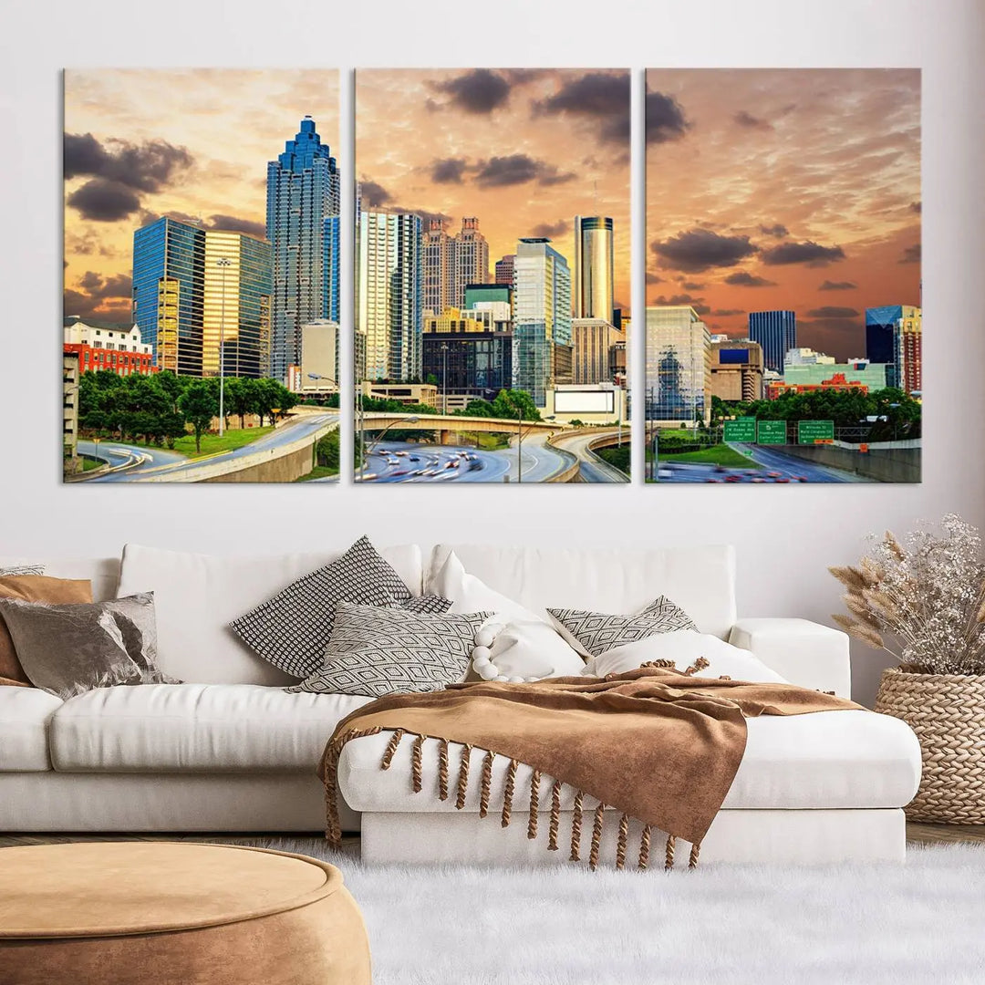 The wall is adorned with the Atlanta City Lights Sunset Skyline Cityscape View Wall Art Canvas Print, elegantly gallery wrapped and showcasing a skyline beneath a partly cloudy sky. This piece is created on museum-quality canvas and features a UV-protective coating to ensure lasting vibrancy.