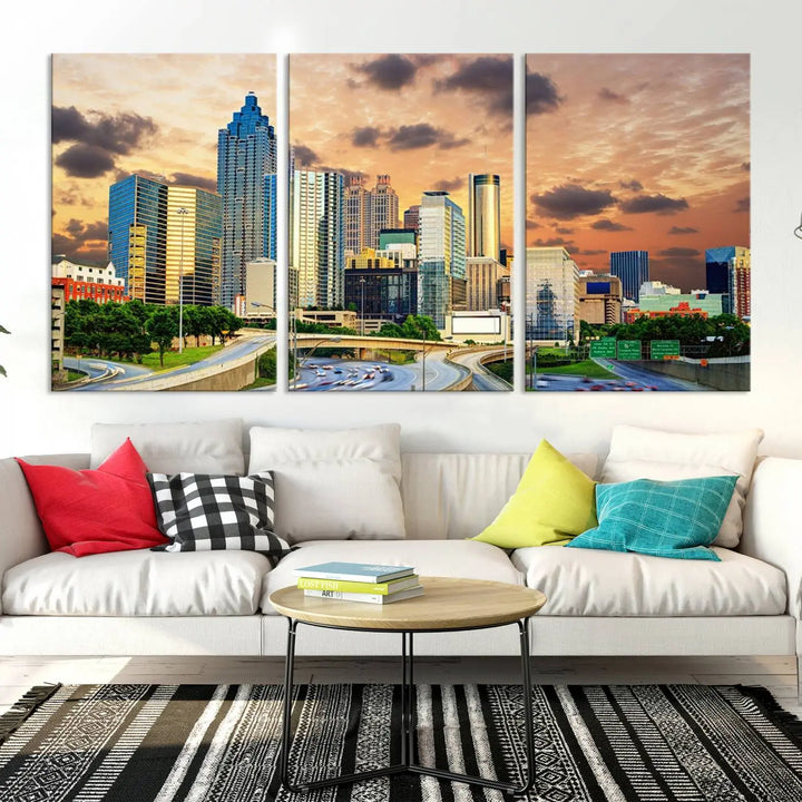 The wall is adorned with the Atlanta City Lights Sunset Skyline Cityscape View Wall Art Canvas Print, elegantly gallery wrapped and showcasing a skyline beneath a partly cloudy sky. This piece is created on museum-quality canvas and features a UV-protective coating to ensure lasting vibrancy.