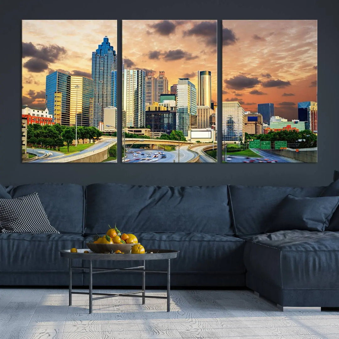 The wall is adorned with the Atlanta City Lights Sunset Skyline Cityscape View Wall Art Canvas Print, elegantly gallery wrapped and showcasing a skyline beneath a partly cloudy sky. This piece is created on museum-quality canvas and features a UV-protective coating to ensure lasting vibrancy.