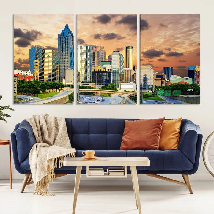 The wall is adorned with the Atlanta City Lights Sunset Skyline Cityscape View Wall Art Canvas Print, elegantly gallery wrapped and showcasing a skyline beneath a partly cloudy sky. This piece is created on museum-quality canvas and features a UV-protective coating to ensure lasting vibrancy.