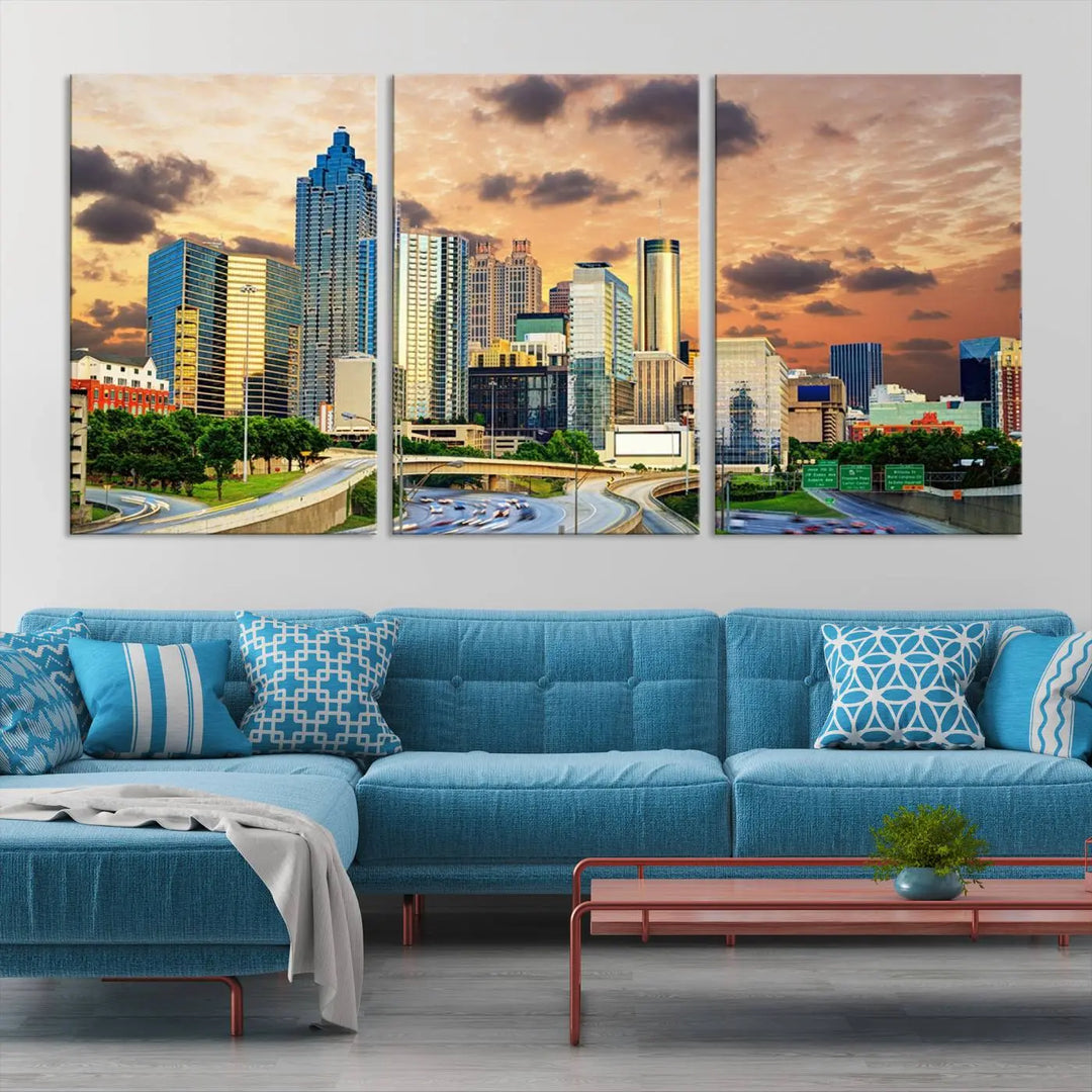 The wall is adorned with the Atlanta City Lights Sunset Skyline Cityscape View Wall Art Canvas Print, elegantly gallery wrapped and showcasing a skyline beneath a partly cloudy sky. This piece is created on museum-quality canvas and features a UV-protective coating to ensure lasting vibrancy.