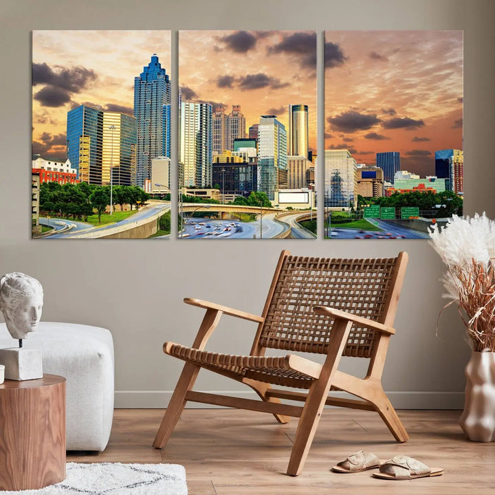 The wall is adorned with the Atlanta City Lights Sunset Skyline Cityscape View Wall Art Canvas Print, elegantly gallery wrapped and showcasing a skyline beneath a partly cloudy sky. This piece is created on museum-quality canvas and features a UV-protective coating to ensure lasting vibrancy.