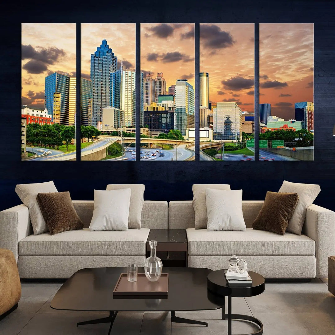 The wall is adorned with the Atlanta City Lights Sunset Skyline Cityscape View Wall Art Canvas Print, elegantly gallery wrapped and showcasing a skyline beneath a partly cloudy sky. This piece is created on museum-quality canvas and features a UV-protective coating to ensure lasting vibrancy.