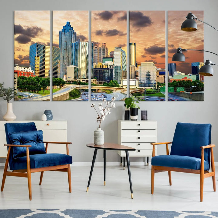 The wall is adorned with the Atlanta City Lights Sunset Skyline Cityscape View Wall Art Canvas Print, elegantly gallery wrapped and showcasing a skyline beneath a partly cloudy sky. This piece is created on museum-quality canvas and features a UV-protective coating to ensure lasting vibrancy.