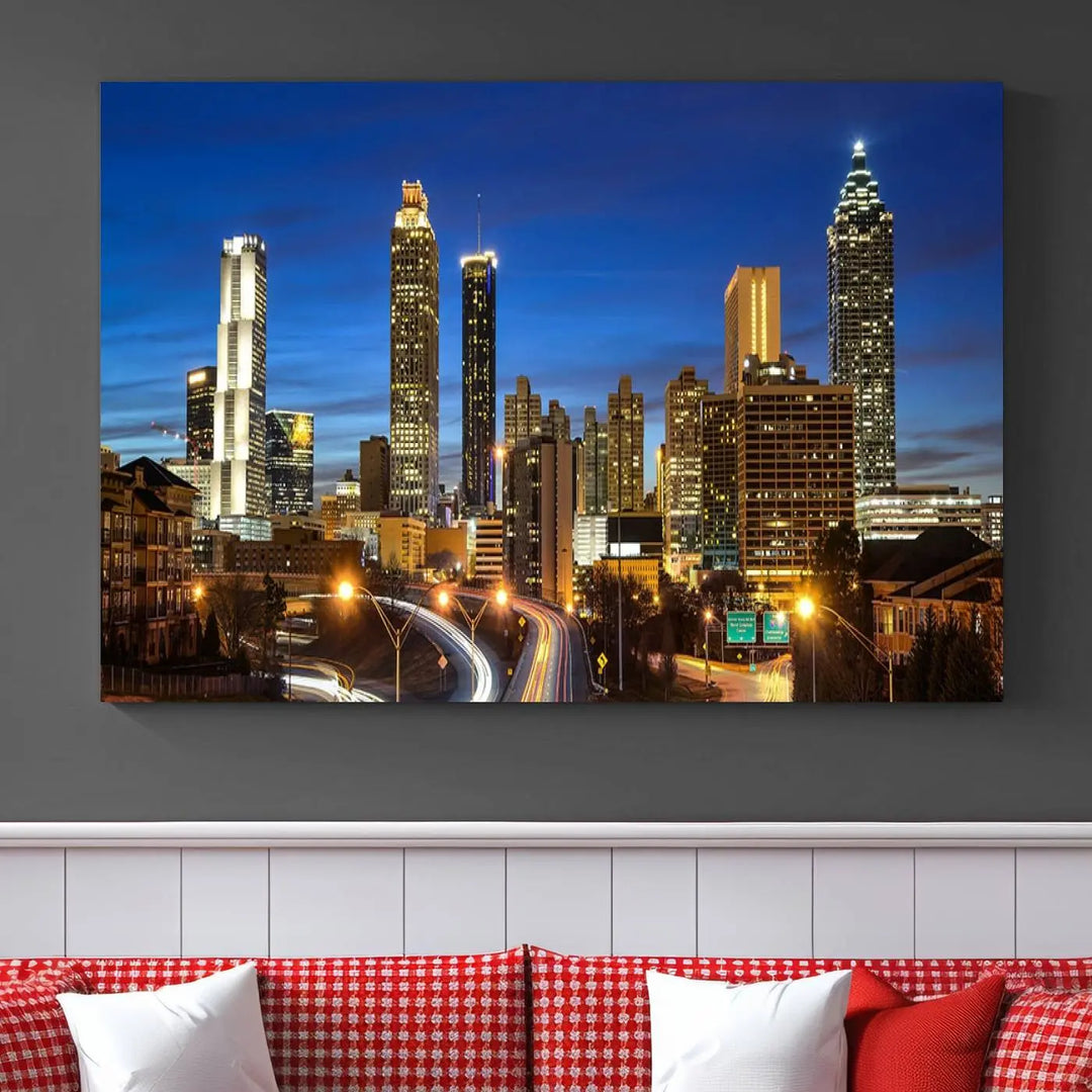 A modern living room is enhanced by the "Atlanta Cityscape View Wall Art Canvas Print" displayed as a triptych on museum-quality canvas. The hand-assembled framed art adds sophistication, crafting an inviting atmosphere. Complete your stylish space effortlessly with free shipping.