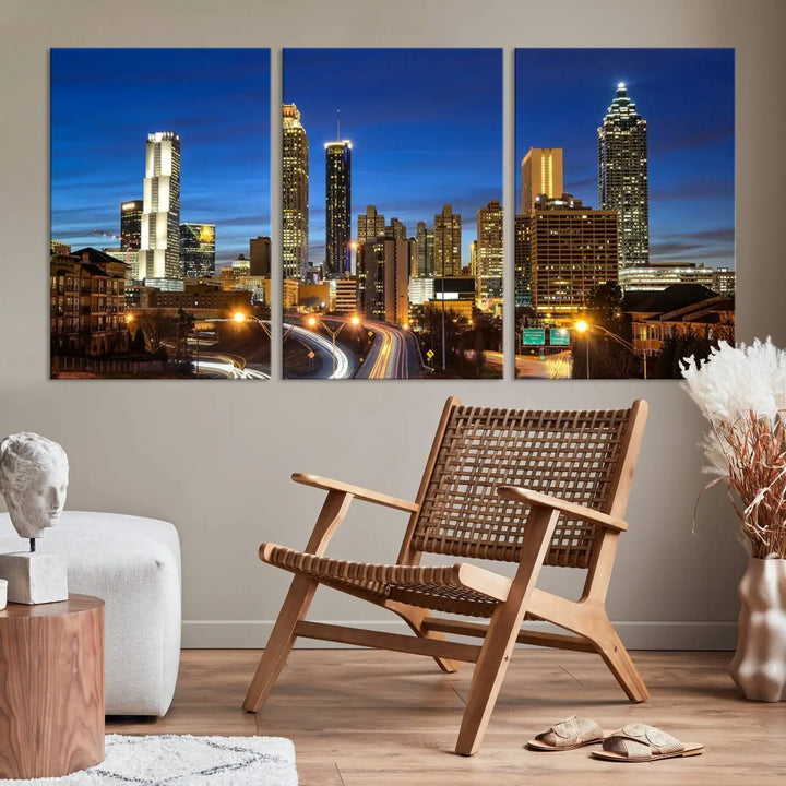 A modern living room is enhanced by the "Atlanta Cityscape View Wall Art Canvas Print" displayed as a triptych on museum-quality canvas. The hand-assembled framed art adds sophistication, crafting an inviting atmosphere. Complete your stylish space effortlessly with free shipping.